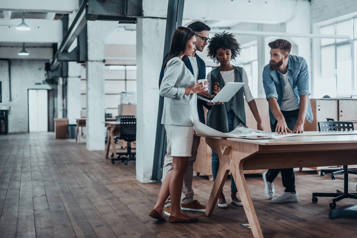 Team collaborating in a modern office space.